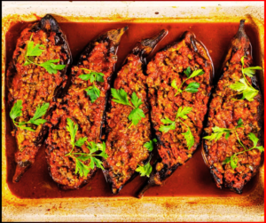 Turkish Karniyarik”, translating to "Stuffed Eggplant," features eggplants slit and stuffed with a tantalizing mixture of minced meat, onions, tomatoes, and spices like parsley and garlic