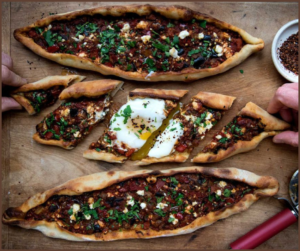 “Turkish Pide bread”, a hallmark of “Turkish cuisine”, is a soft, oval-shaped flatbread with a slightly chewy crust and a delightful aroma
