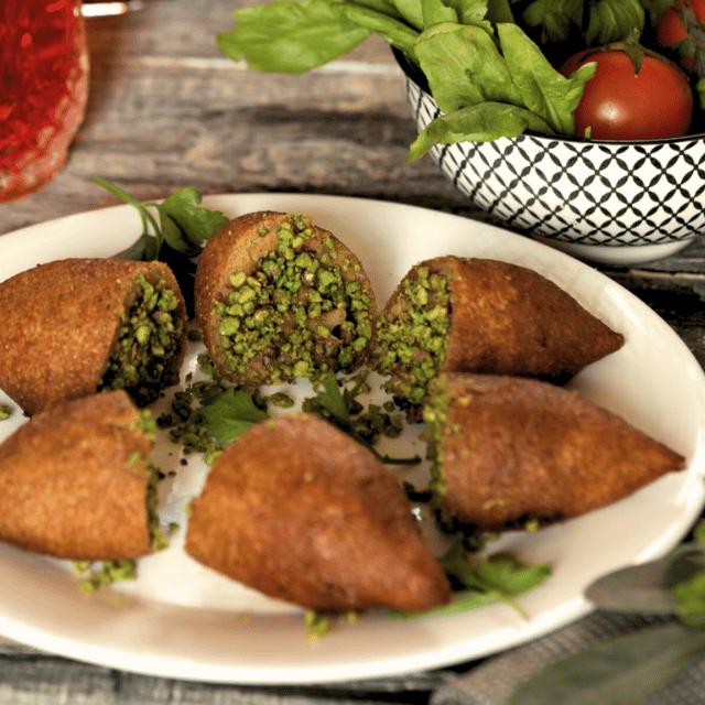 Içli köfte: These are savory dumplings made with bulgur wheat dough and filled with a seasoned ground meat mixture