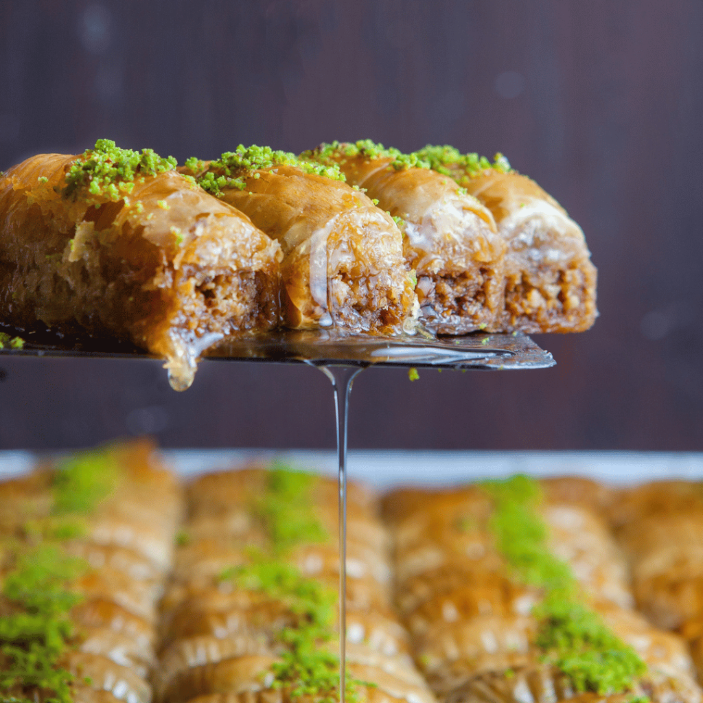 Baklava:  This iconic dessert needs no introduction. Flaky layers of phyllo pastry, filled with nuts and drenched in syrup