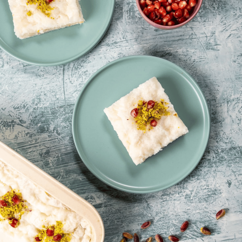 Gullaç: Thin sheets of phyllo dough layered with rosewater milk and sprinkled with pomegranate seeds, offering a light and refreshing treat